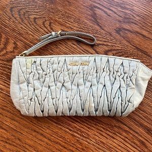 Miu miu wristlet. Gold accent.